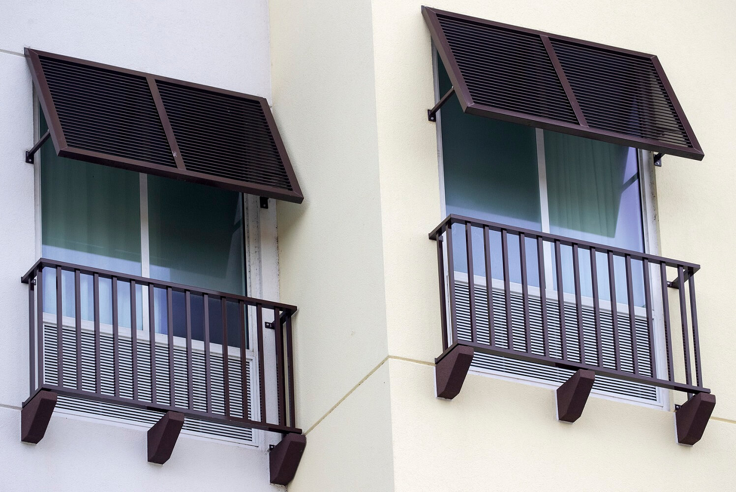 hotel bahama shutters with railings below