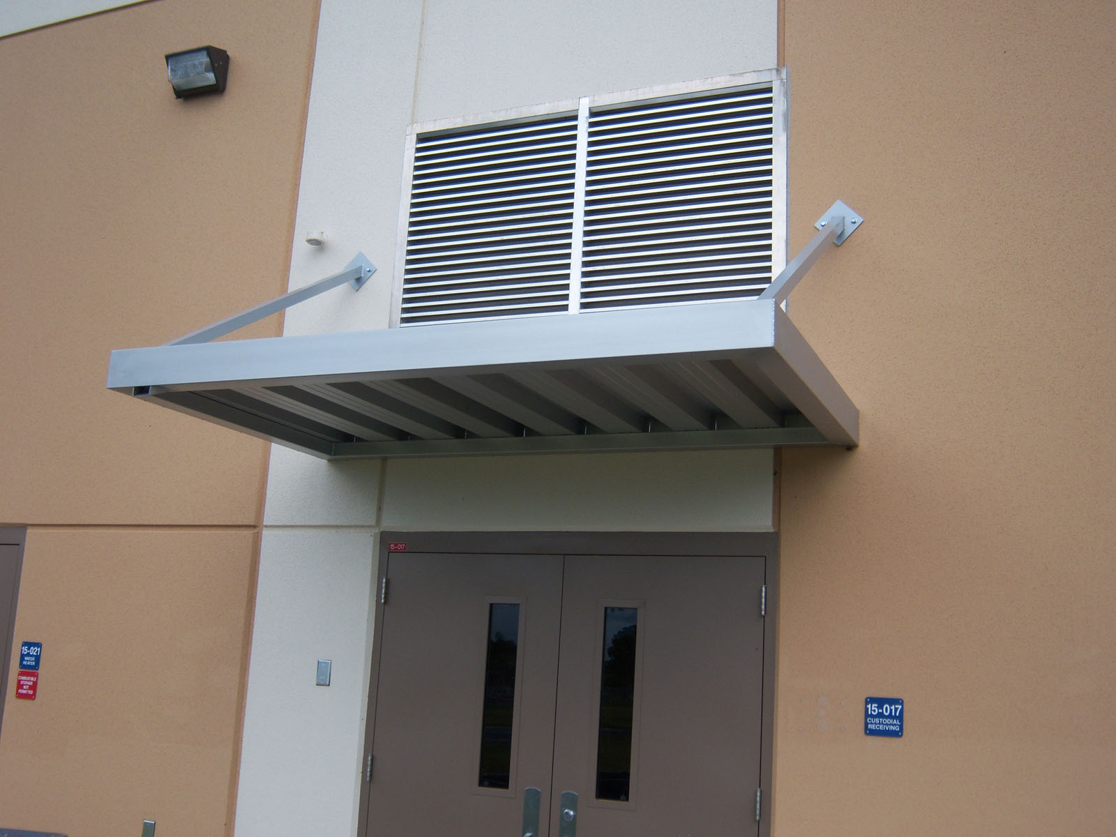 metal suspended canopy for building back entrance