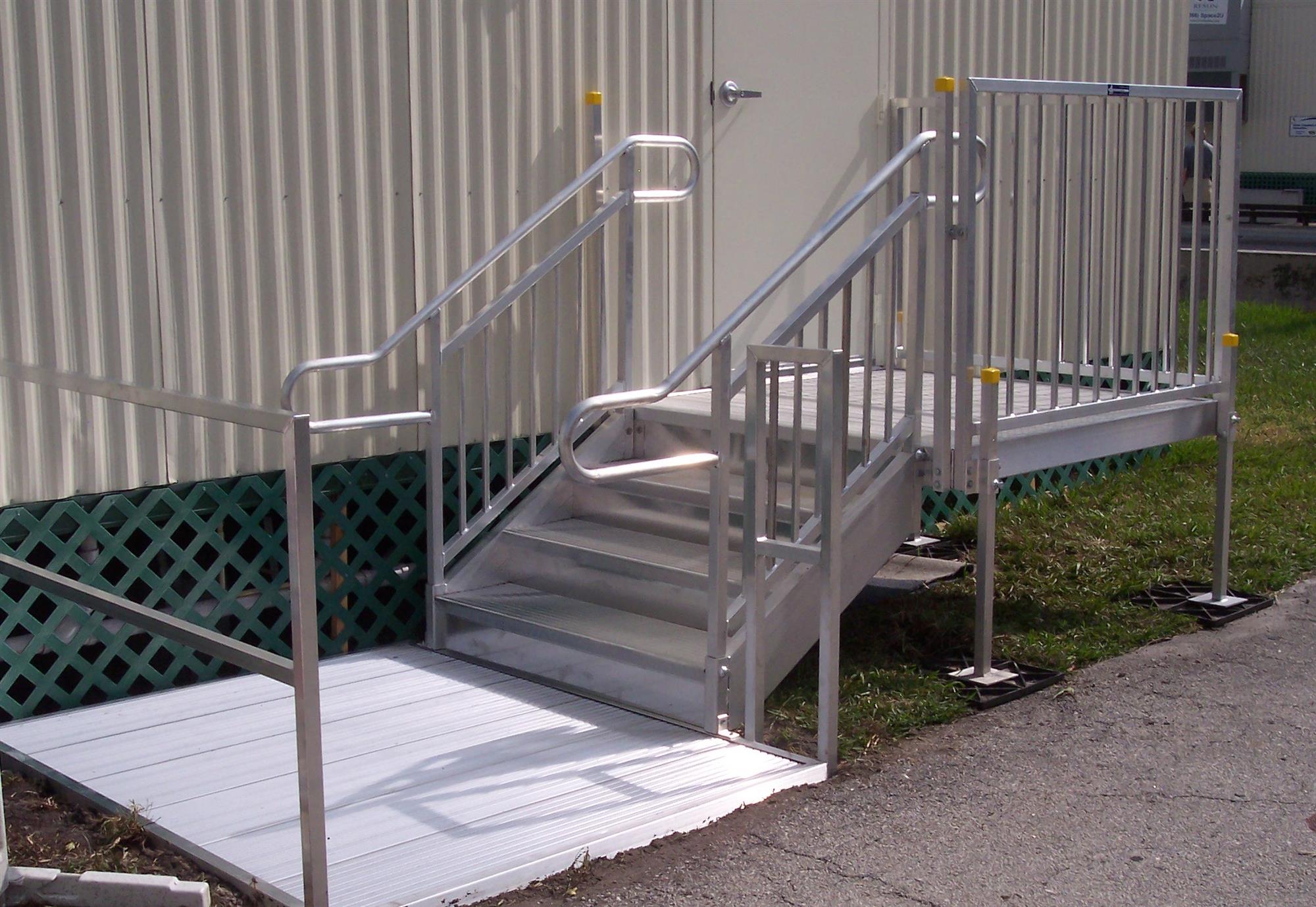 elevated entryway with aluminum stairs